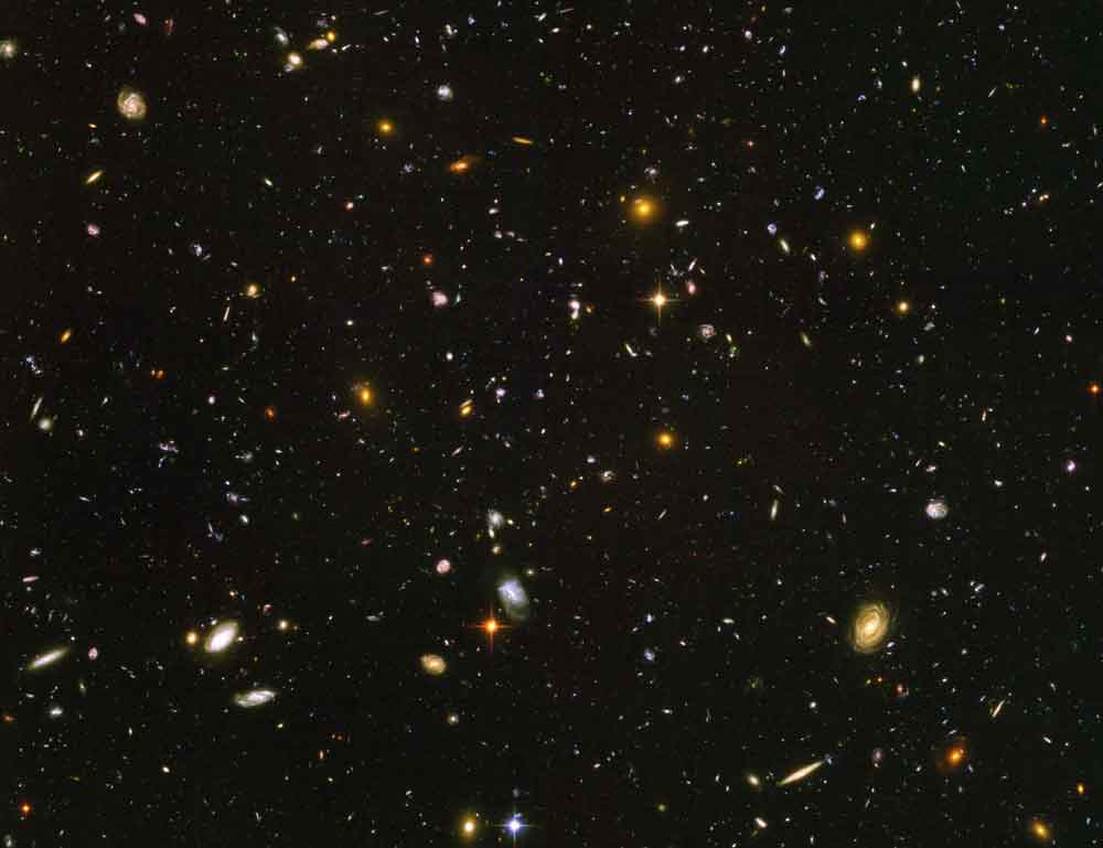 Well, nothing, really: The Hubble Space Telescope took this image of a part of the sky where nothing could be seen - nothing, really. After a very long exposure of 3 months it became apparent that there are plenty of galaxies out there where you see nothing.